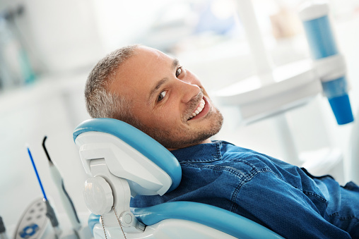 A patient in dental chair at Surf City Oral and Maxillofacial Surgery.