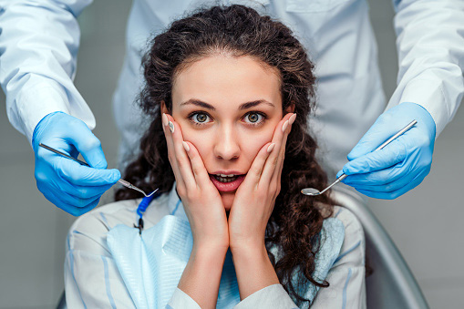 A woman preparing to have tooth removed